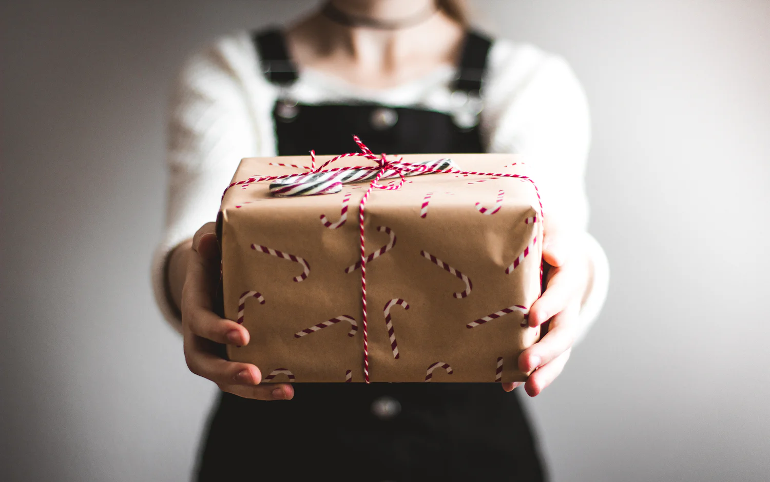 A wrapped gift being handed over
