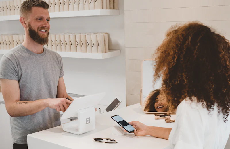A customer being served at a store counter